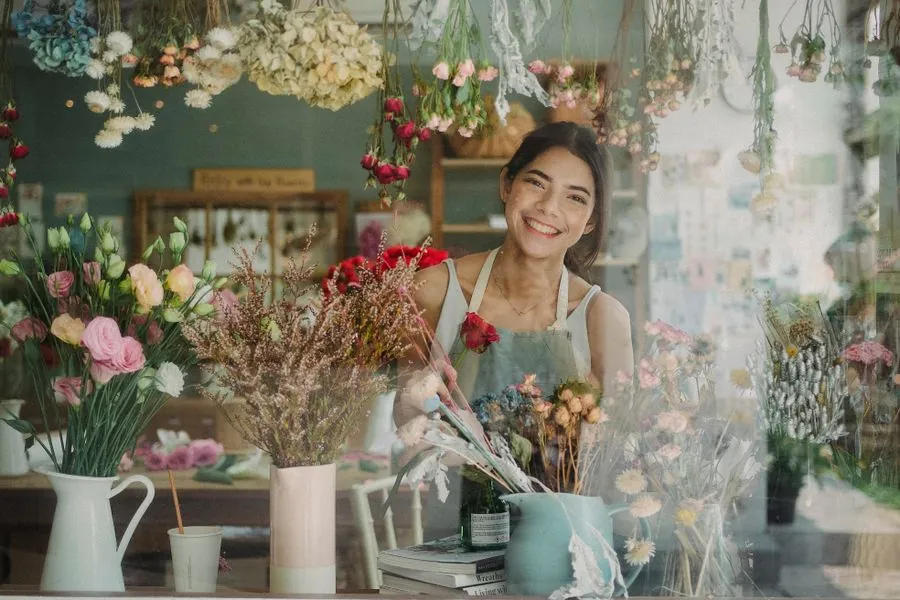 A florist arranging flowers in a shop