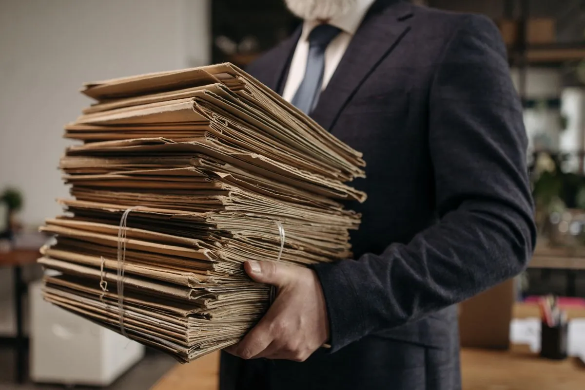 A stack of white paper tied with string